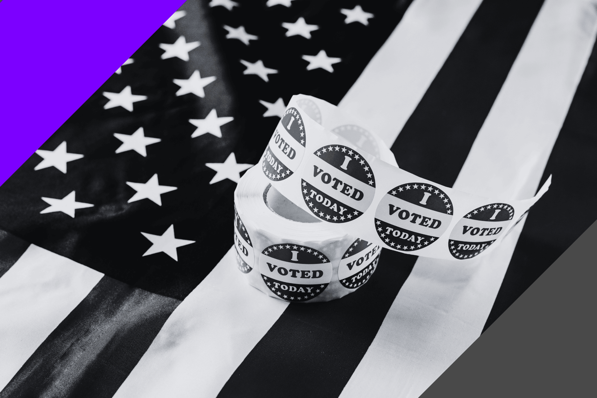 black and white image of usa flag which a reel of 'I voted' stickers